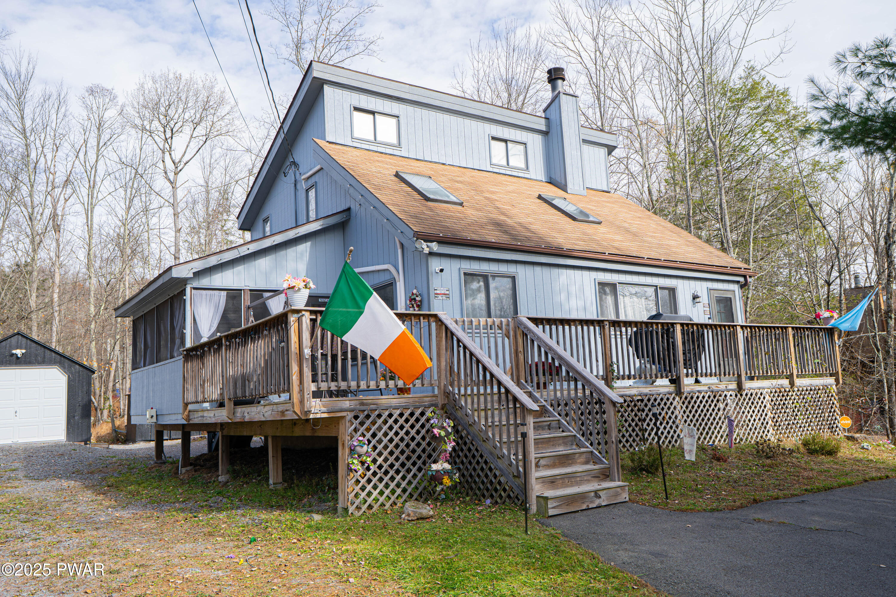a view of house with outdoor space and sitting area