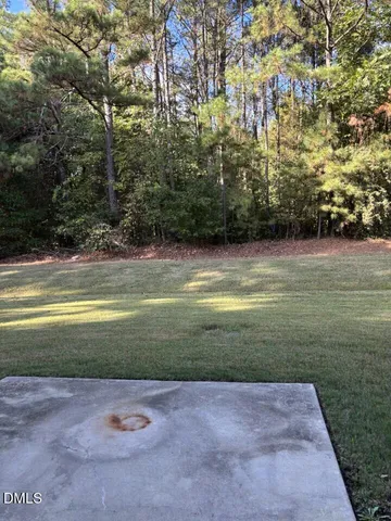 a view of a fountain in front of a house