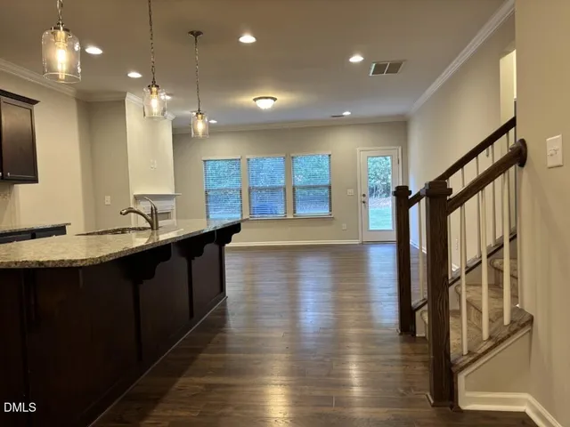 a open kitchen with lots of counter space and a sink
