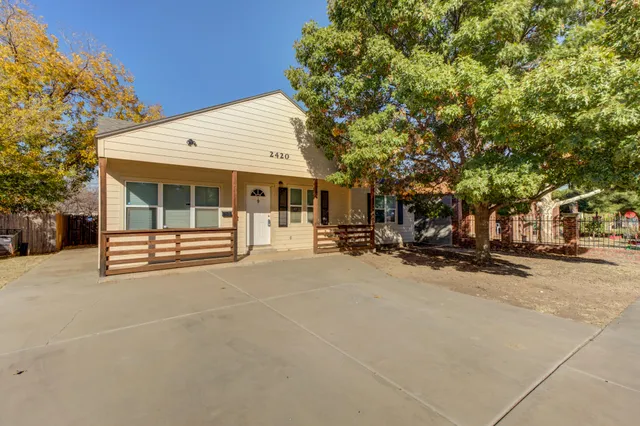 a view of house with outdoor space and porch