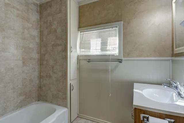 a bathroom with a sink and a bathtub
