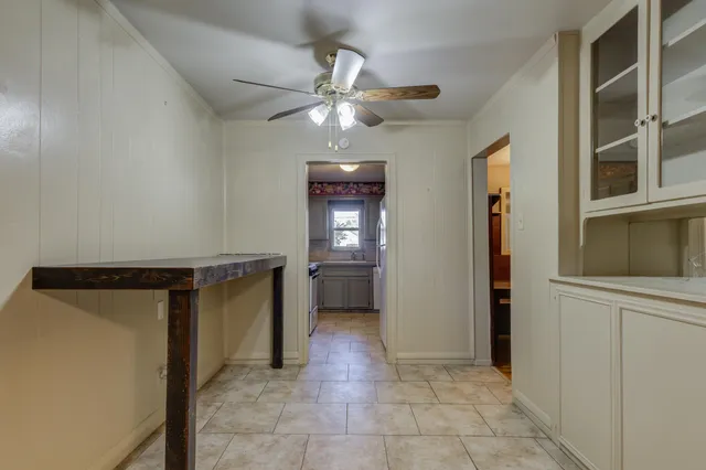 a view of a hallway with a bathroom