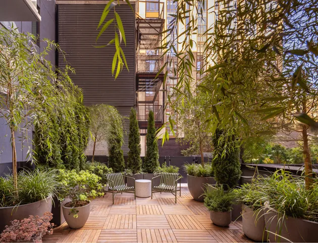 a view of a building with sitting area