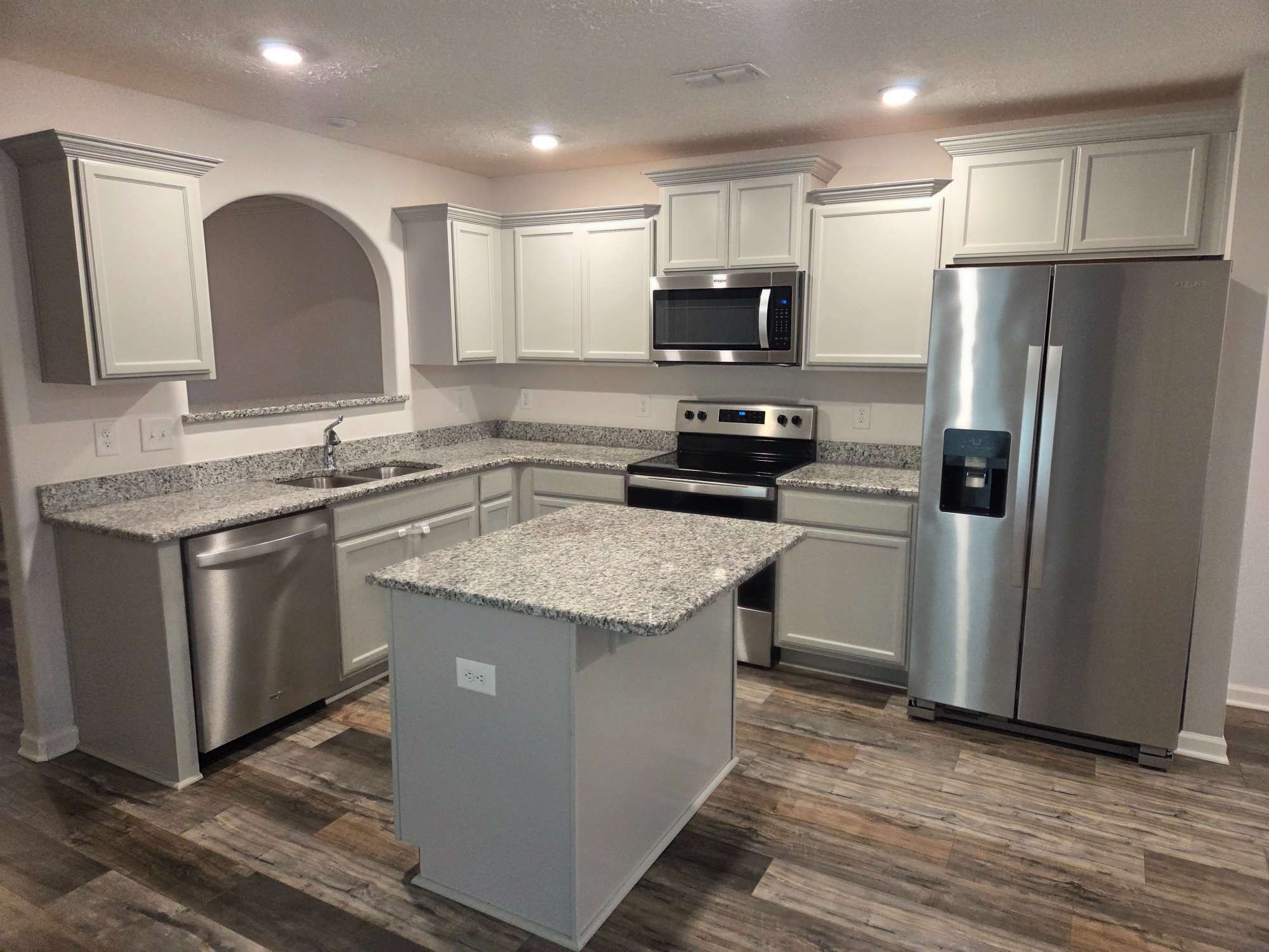 1709 Calypso Drive Murfreesboro, TN 37128 - Photo 4 of 16 a kitchen with stainless steel appliances granite countertop a sink stove and refrigerator