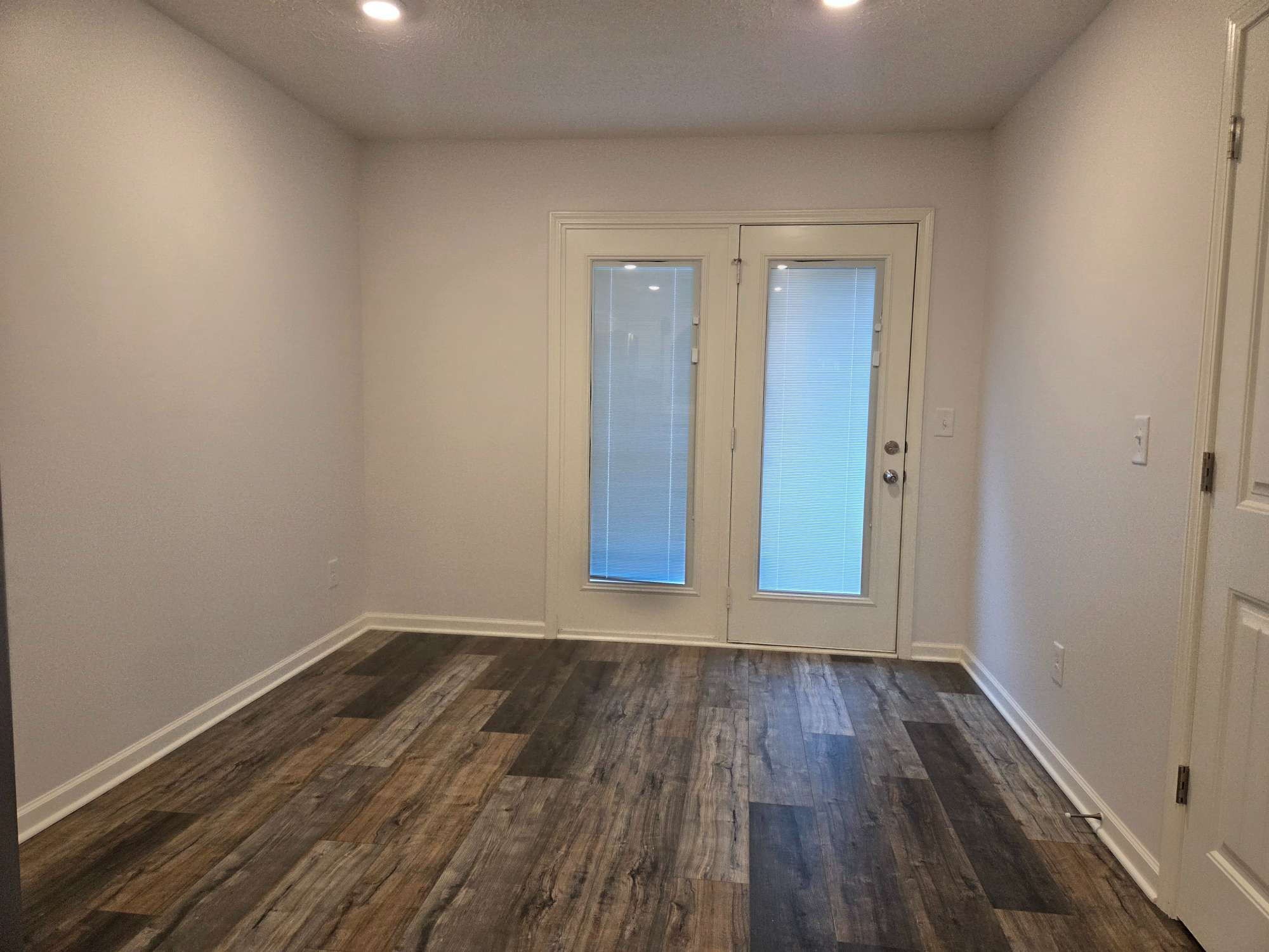 1709 Calypso Drive Murfreesboro, TN 37128 - Photo 5 of 16 a view of a room with wooden floor and white walls