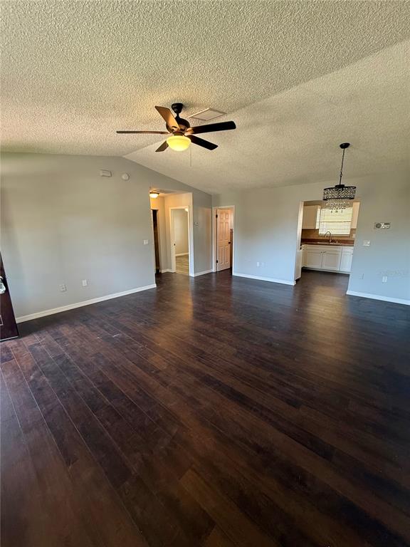 8124 Cormel Street, Unit 8126 Port Richey, FL 34668 - Photo 4 of 13 a view of an empty room with wooden floor