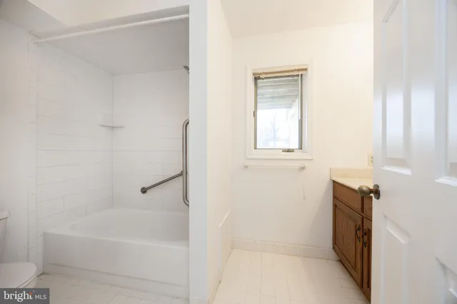 a bathroom with a bathtub sink and toilet