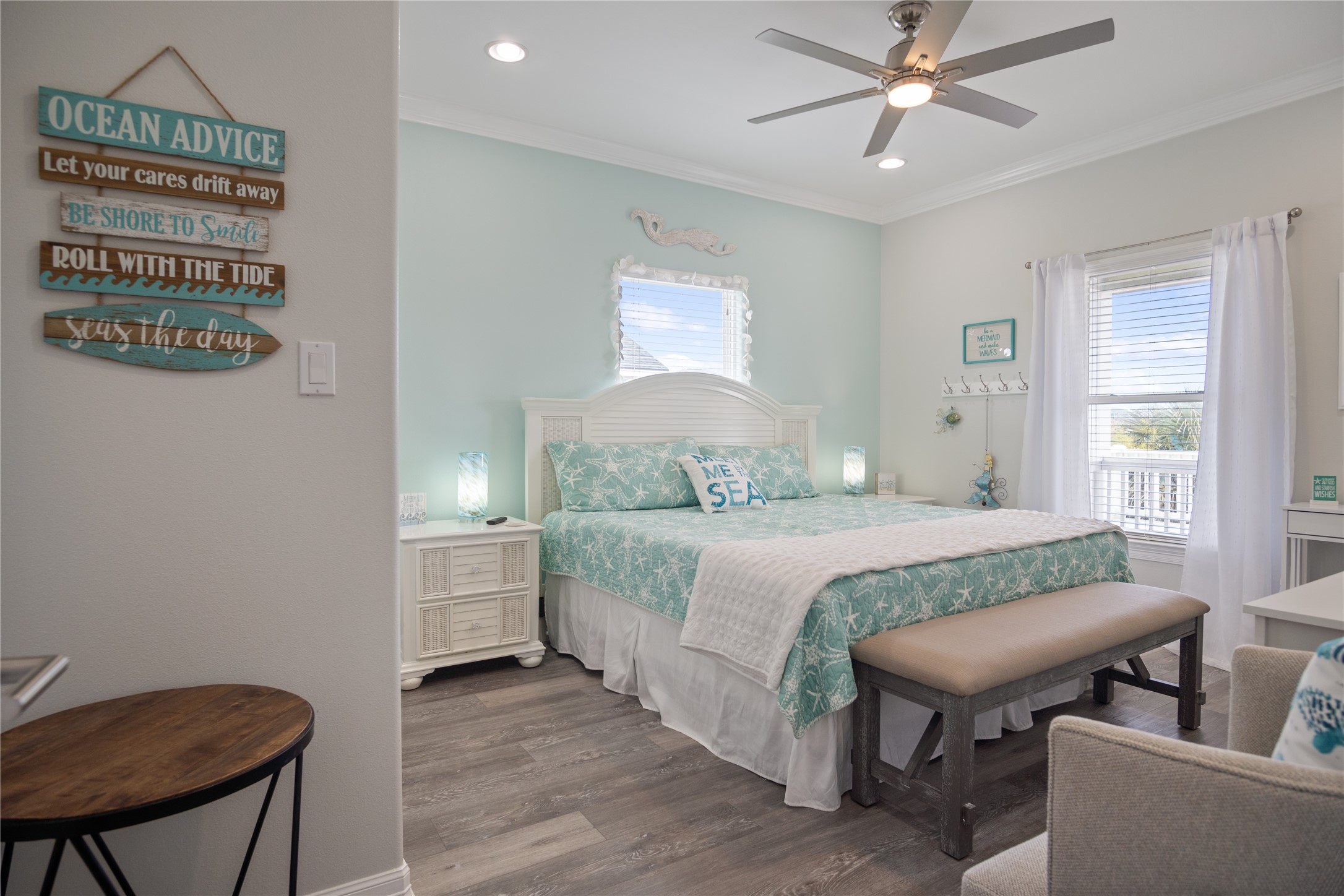 956 Biscayne Crystal Beach, TX 77650 - Photo 16 of 46 a bedroom with a bed and a chandelier