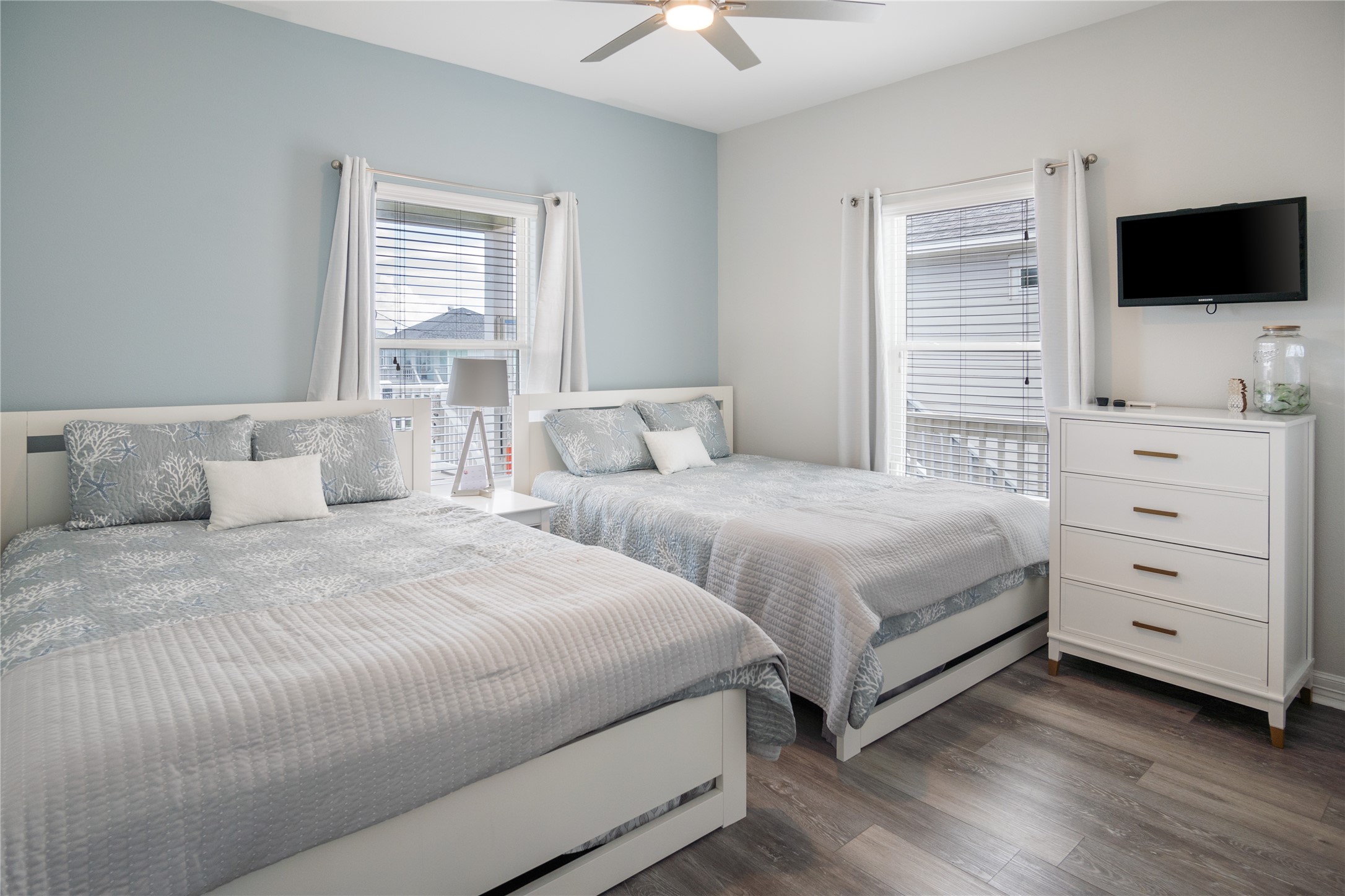 956 Biscayne Crystal Beach, TX 77650 - Photo 20 of 46 a bedroom with a bed and a flat tv screen on a dresser