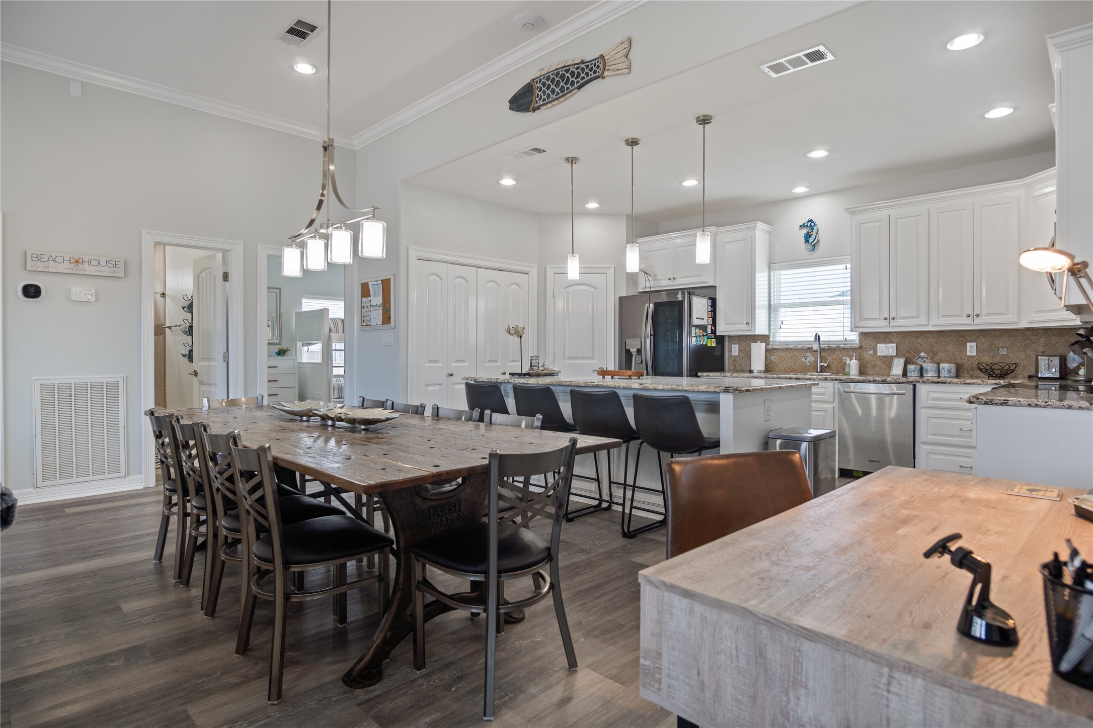 956 Biscayne Crystal Beach, TX 77650 - Photo 2 of 46 a large kitchen with a table and chairs