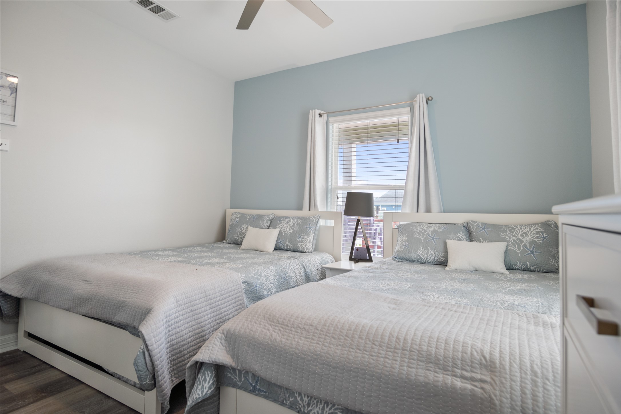 956 Biscayne Crystal Beach, TX 77650 - Photo 21 of 46 a bedroom with two beds and a window