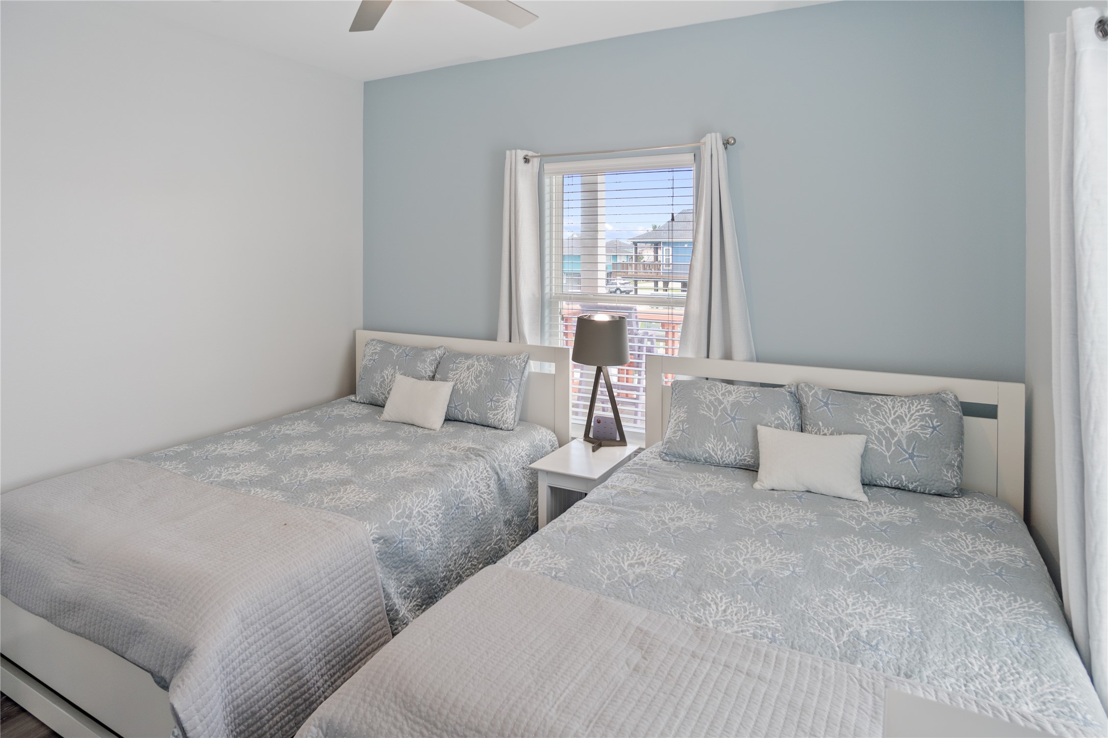 956 Biscayne Crystal Beach, TX 77650 - Photo 22 of 46 a bedroom with two beds and a window