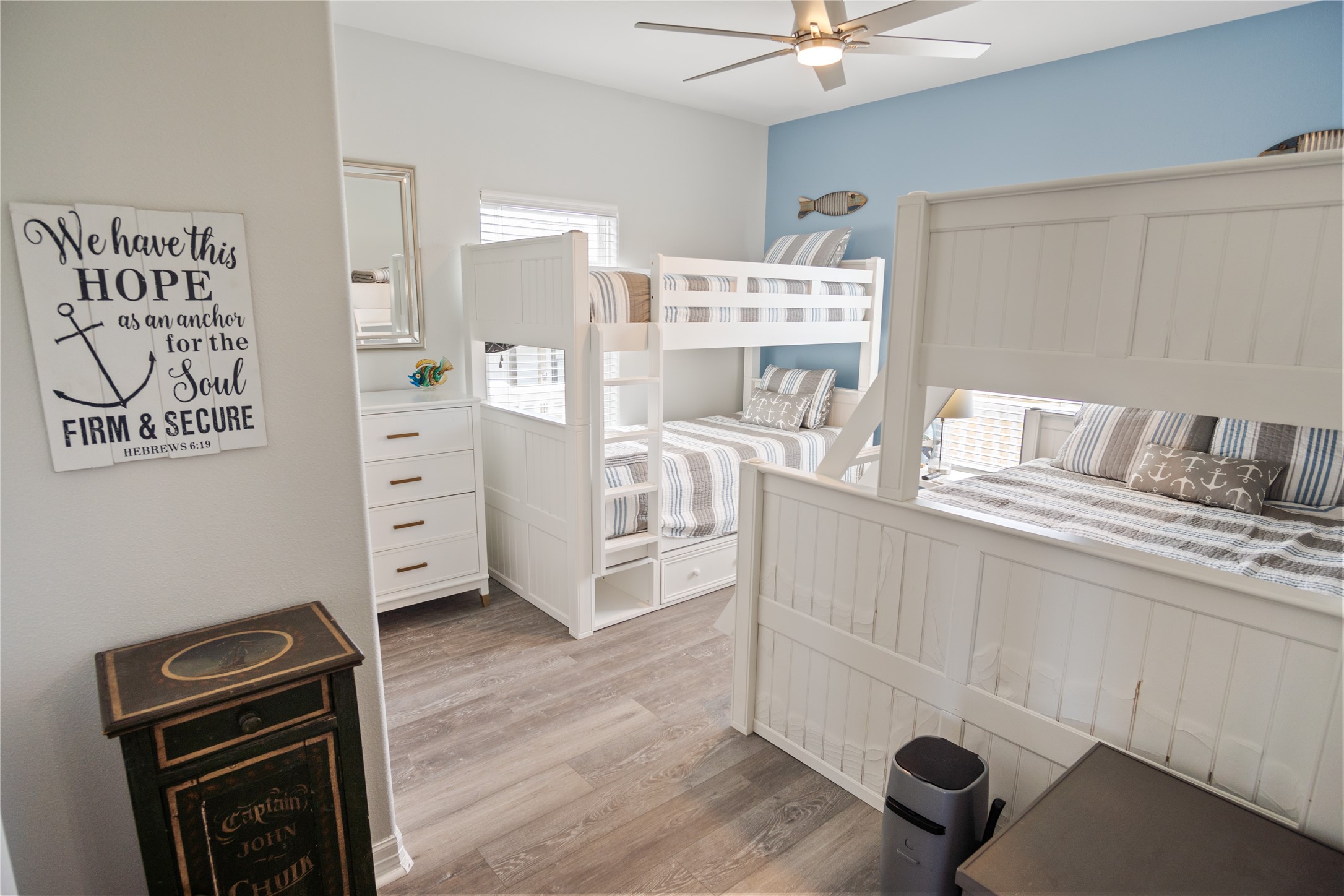 956 Biscayne Crystal Beach, TX 77650 - Photo 25 of 46 a room with a baby crib furniture and a dresser