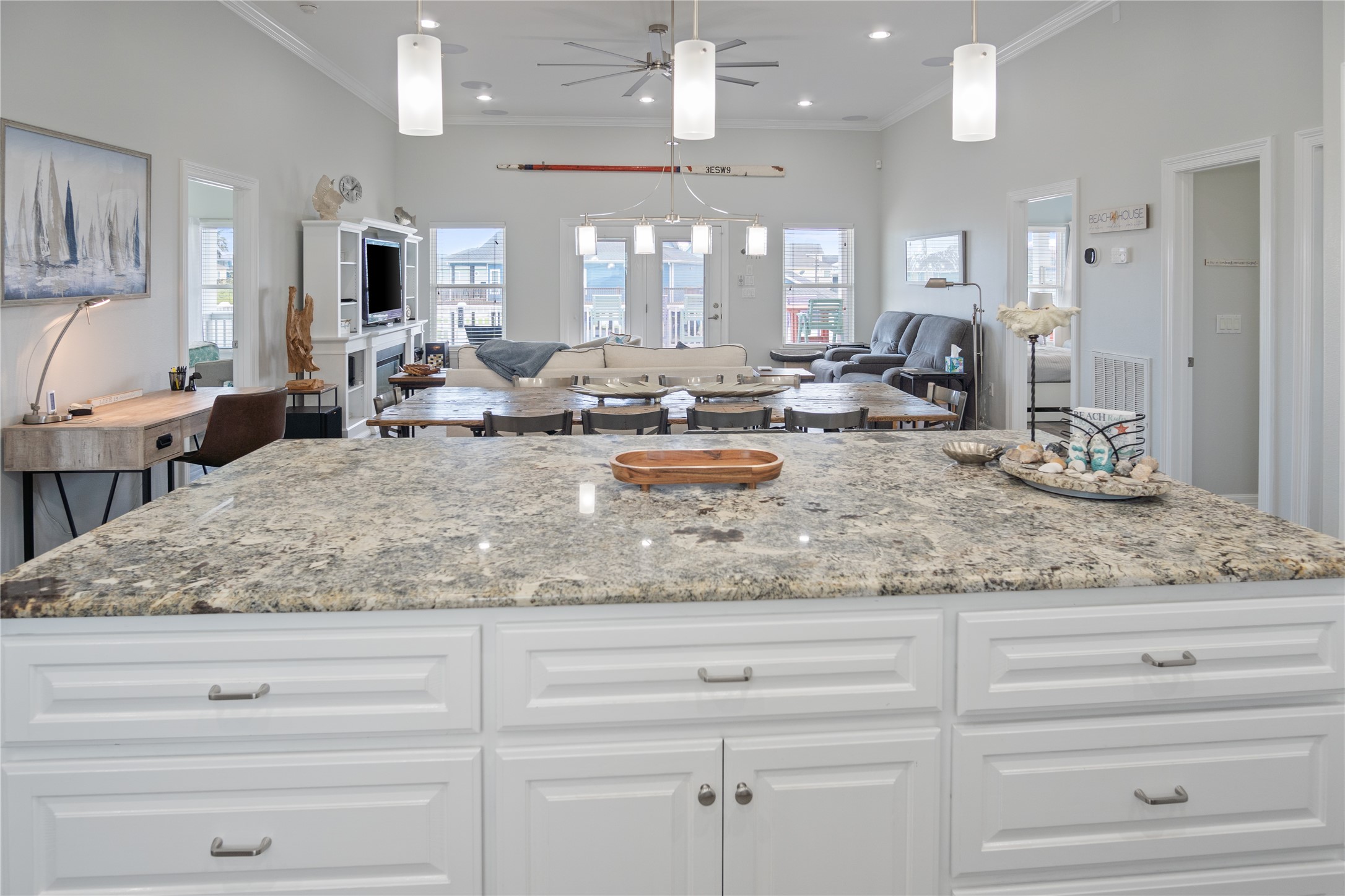 956 Biscayne Crystal Beach, TX 77650 - Photo 6 of 46 a view of living room kitchen with granite countertop stainless steel appliances white cabinets and couches