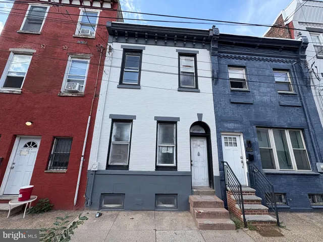 a front view of a building with many windows
