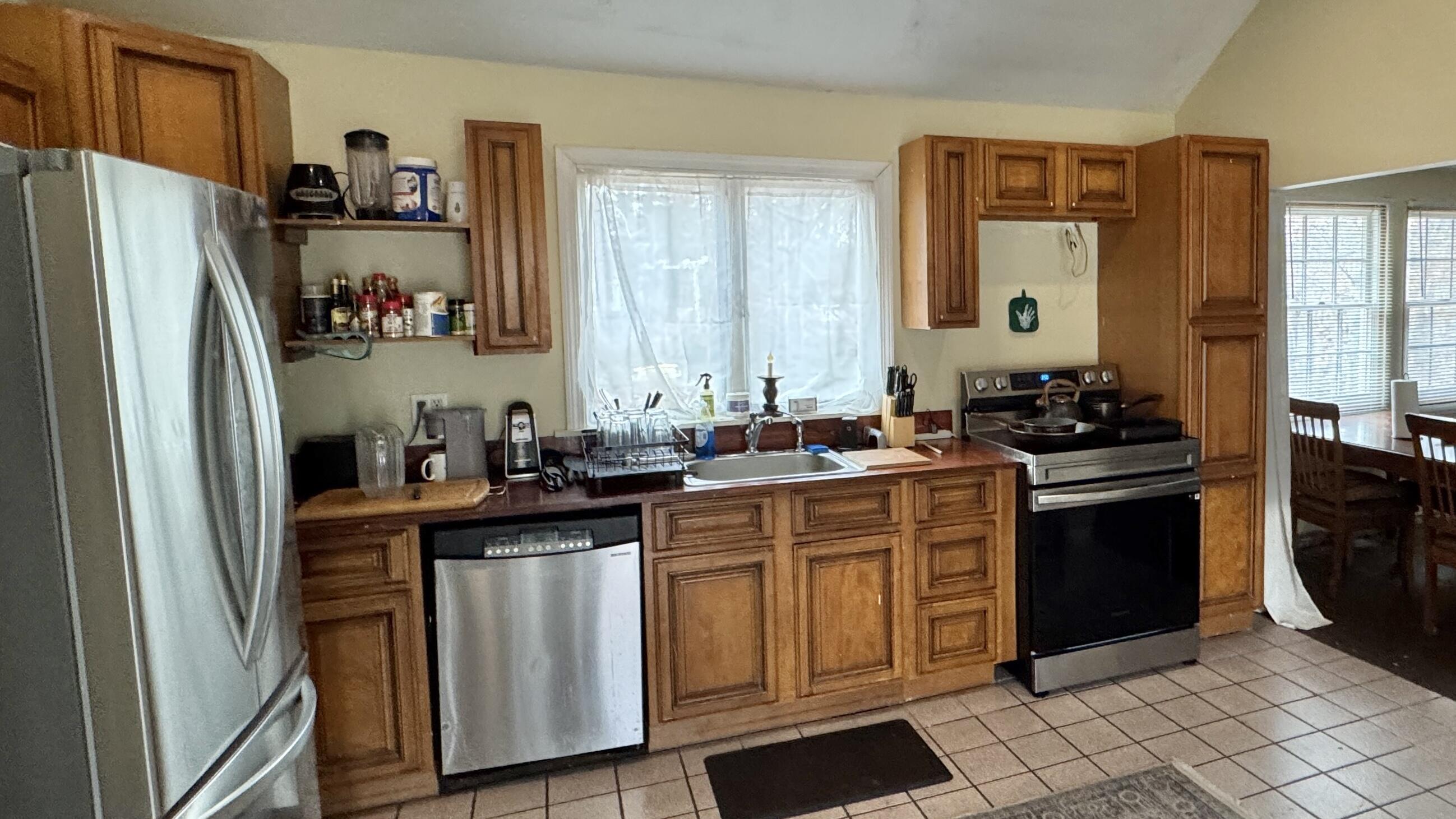 279 Samoset Road Eastham, MA 02642 - Photo 7 of 22 a kitchen with stainless steel appliances a refrigerator sink and cabinets