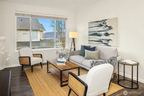 a living room with furniture and a table