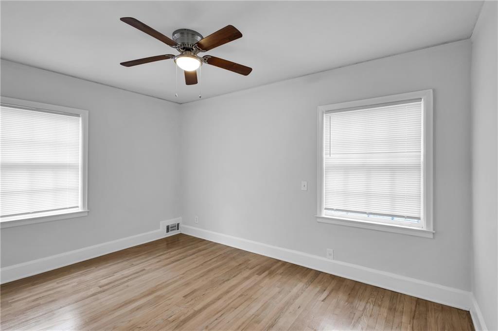 2880 Old Lost Mountain Road, Unit A Powder Springs, GA 30127 - Photo 11 of 23 an empty room with wooden floor and windows