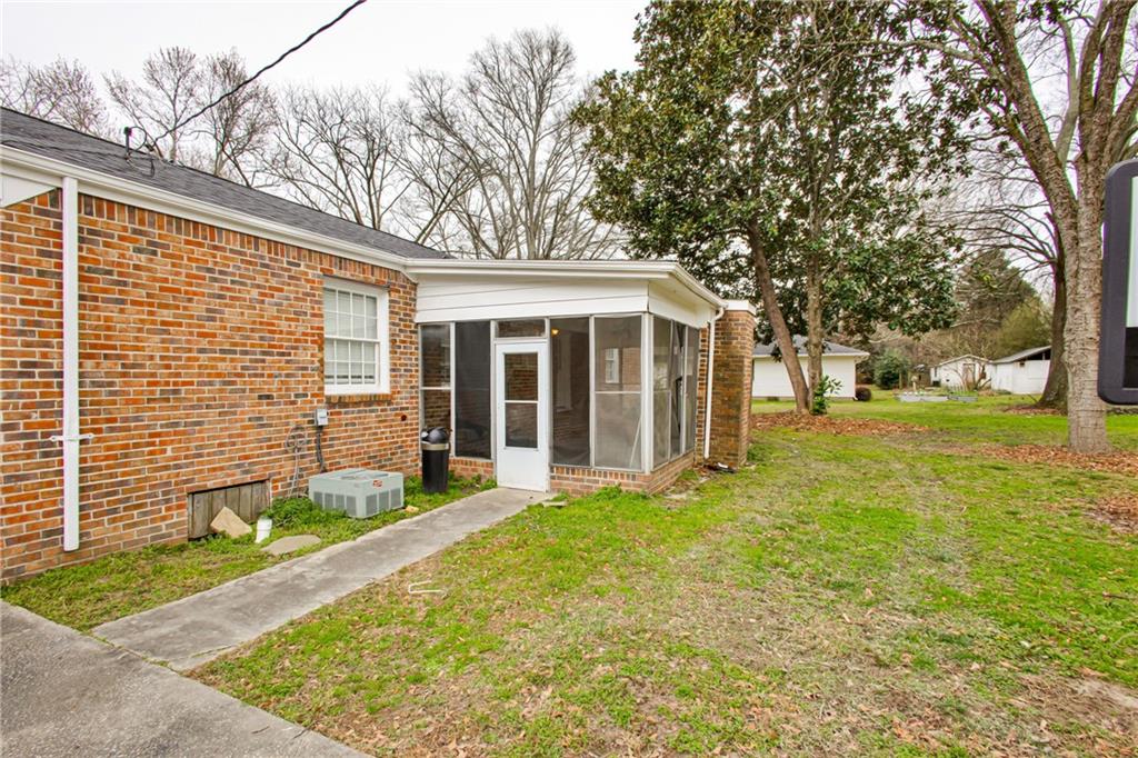 2880 Old Lost Mountain Road, Unit A Powder Springs, GA 30127 - Photo 15 of 23 a view of a house with backyard and a tree