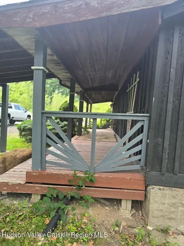 a view of backyard with a small cabin
