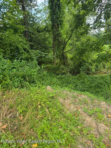a view of room with window and front door