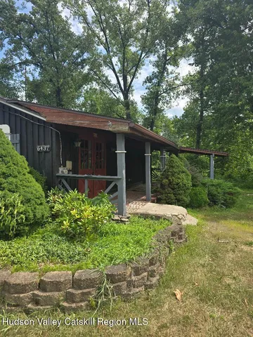 a view of a backyard with garden