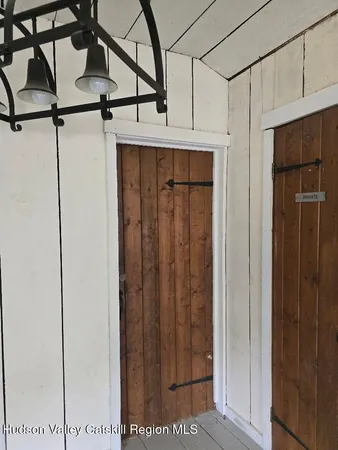 a backyard of a house with outdoor seating