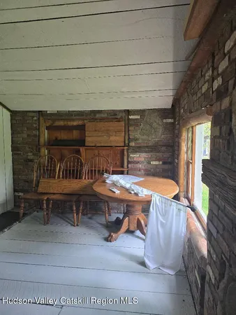 a view of a chairs and table in a patio