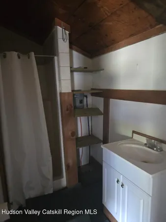 a bathroom with a toilet a sink and a vanity