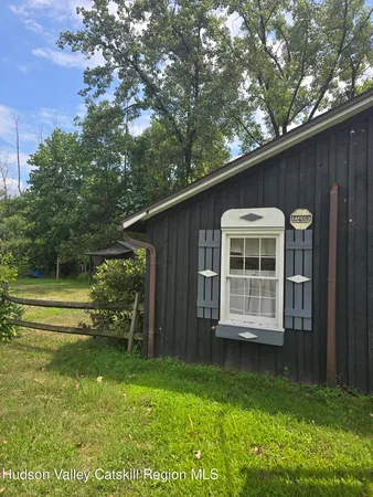 a backyard of a house with lots of green space