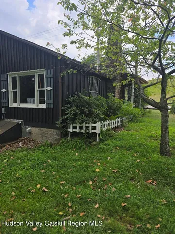 a house view with a garden space