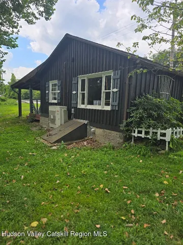 a backyard of a house with seating space