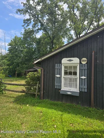 a backyard of a house with lots of green space