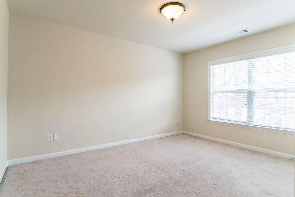 6120 Joybrook Road Duluth, GA 30097 - Photo 23 of 30 an empty room with a window