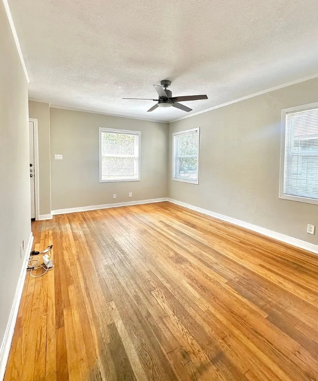 2712 Windsor Road Austin, TX 78703 - Photo 5 of 10 a view of a room with wooden floor and a ceiling fan