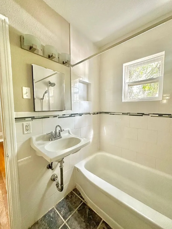 2712 Windsor Road Austin, TX 78703 - Photo 8 of 10 a bathroom with a sink a bathtub and a mirror