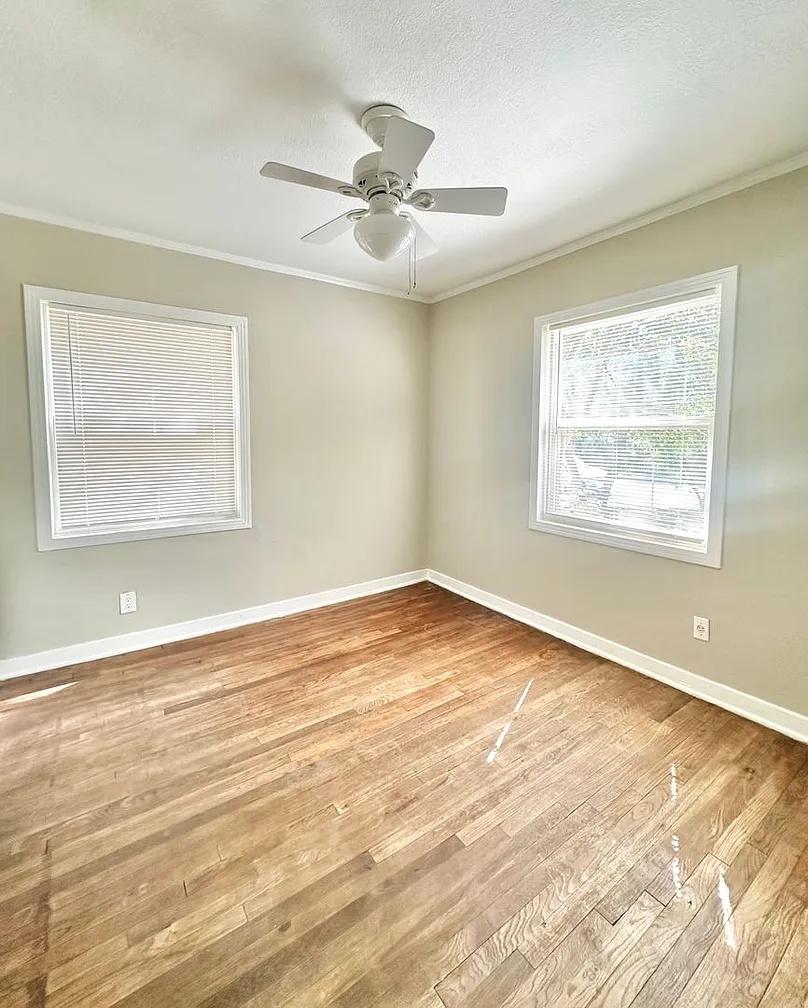 2712 Windsor Road Austin, TX 78703 - Photo 10 of 10 Spare room with light wood-style floors, ornamental molding, a textured ceiling, and ceiling fan