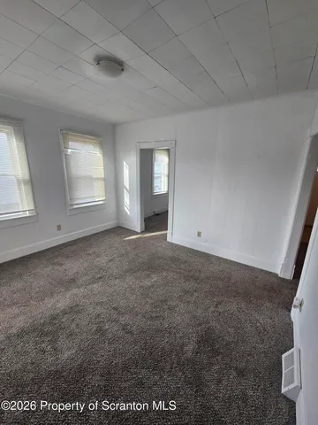 a kitchen with stainless steel appliances a sink stove and cabinets