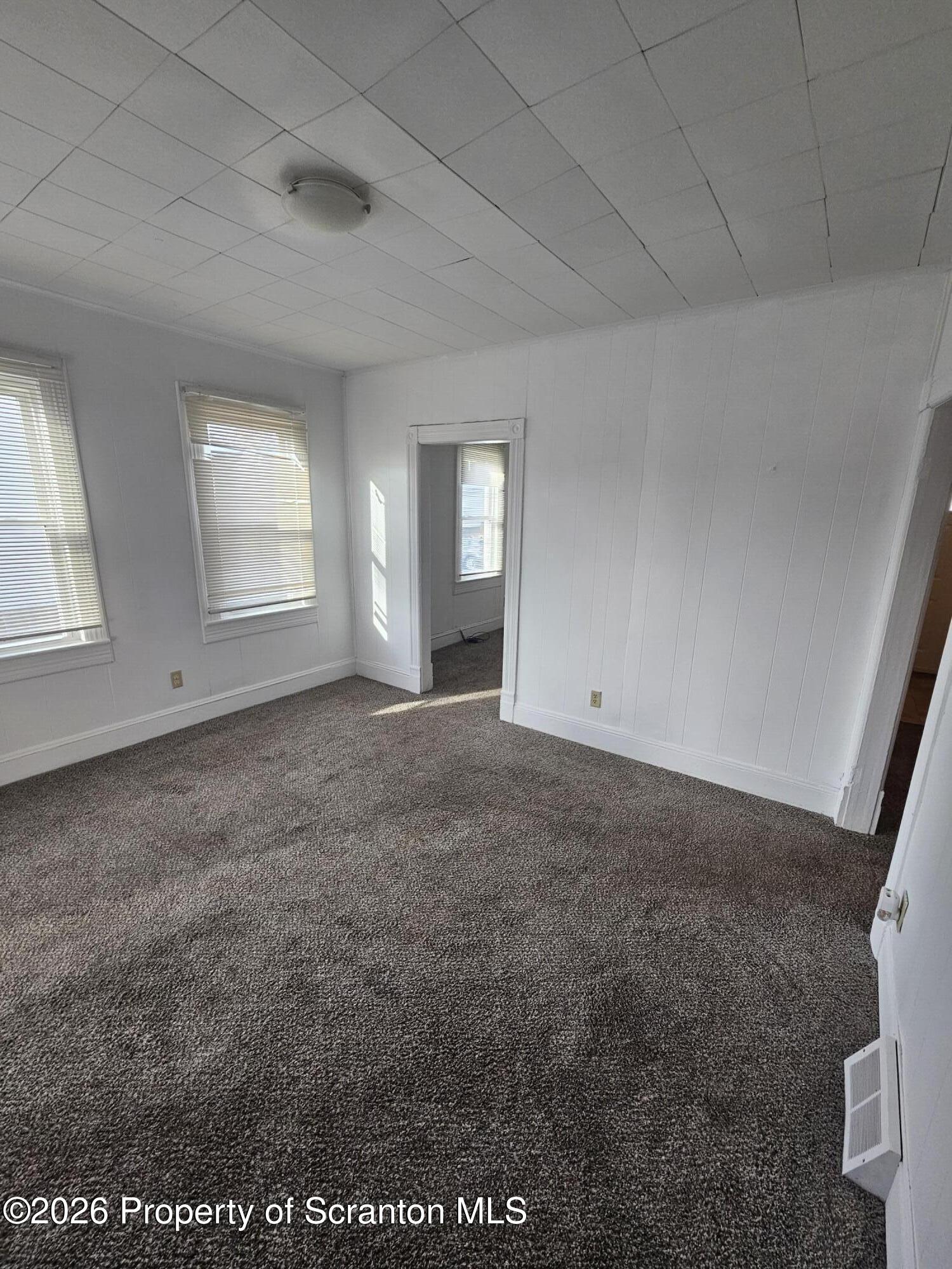 1044 John Avenue Scranton, PA 18510 - Photo 11 of 28 an empty room with windows