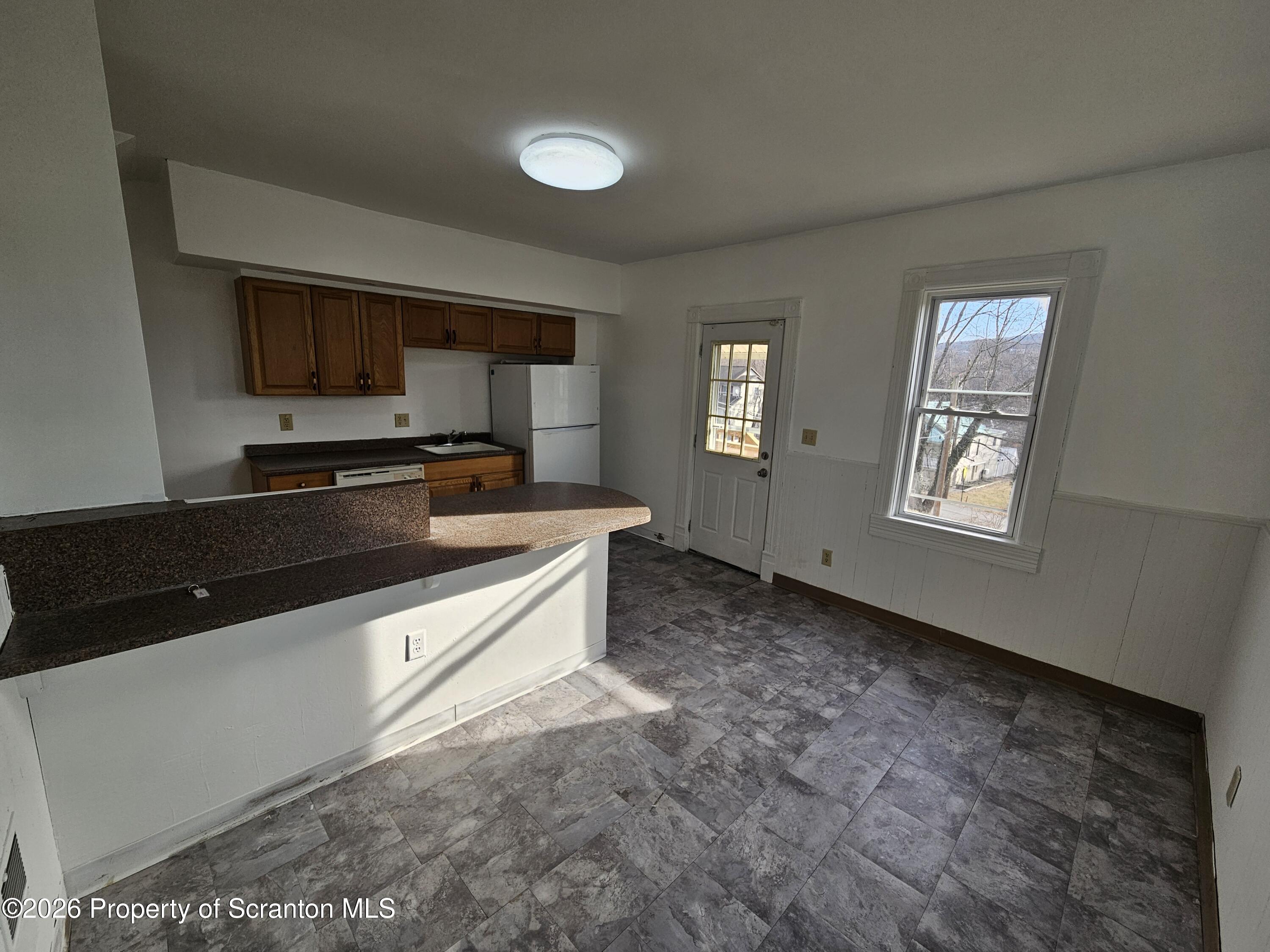 1044 John Avenue Scranton, PA 18510 - Photo 13 of 28 a kitchen with stainless steel appliances a sink stove and cabinets