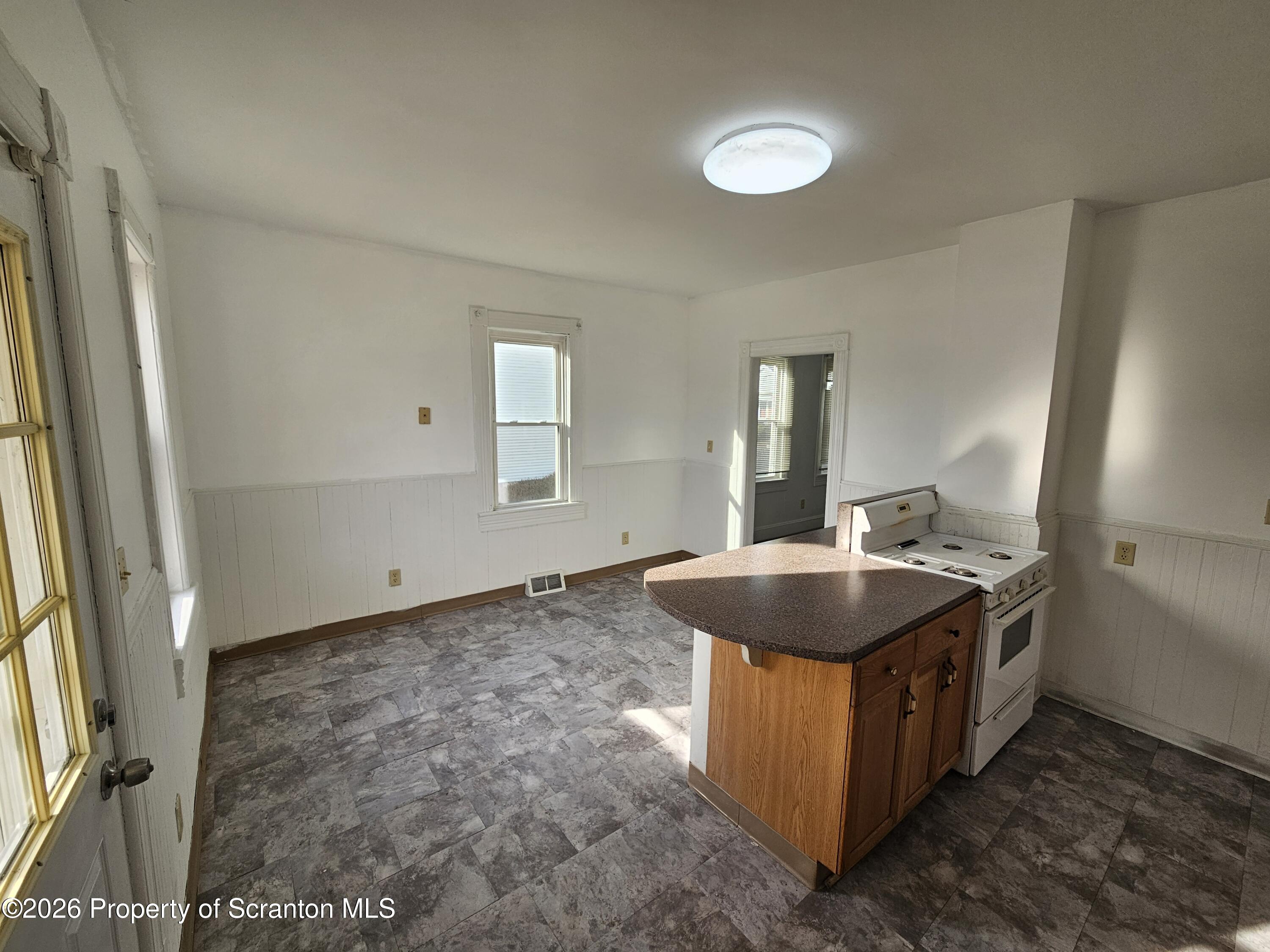 1044 John Avenue Scranton, PA 18510 - Photo 14 of 28 a bathroom with a granite countertop sink and a mirror