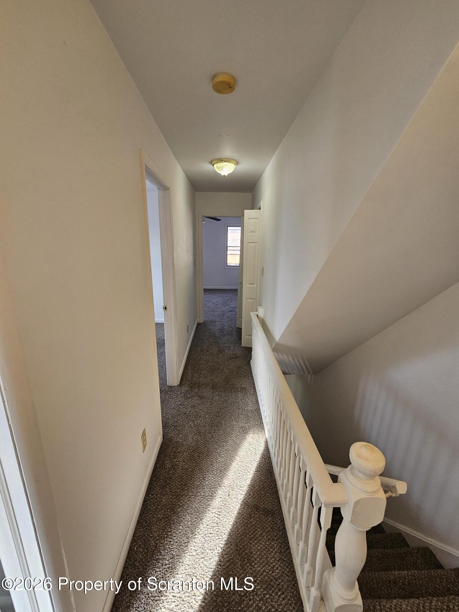 1044 John Avenue Scranton, PA 18510 - Photo 16 of 28 a view of a hallway with furniture and stairs