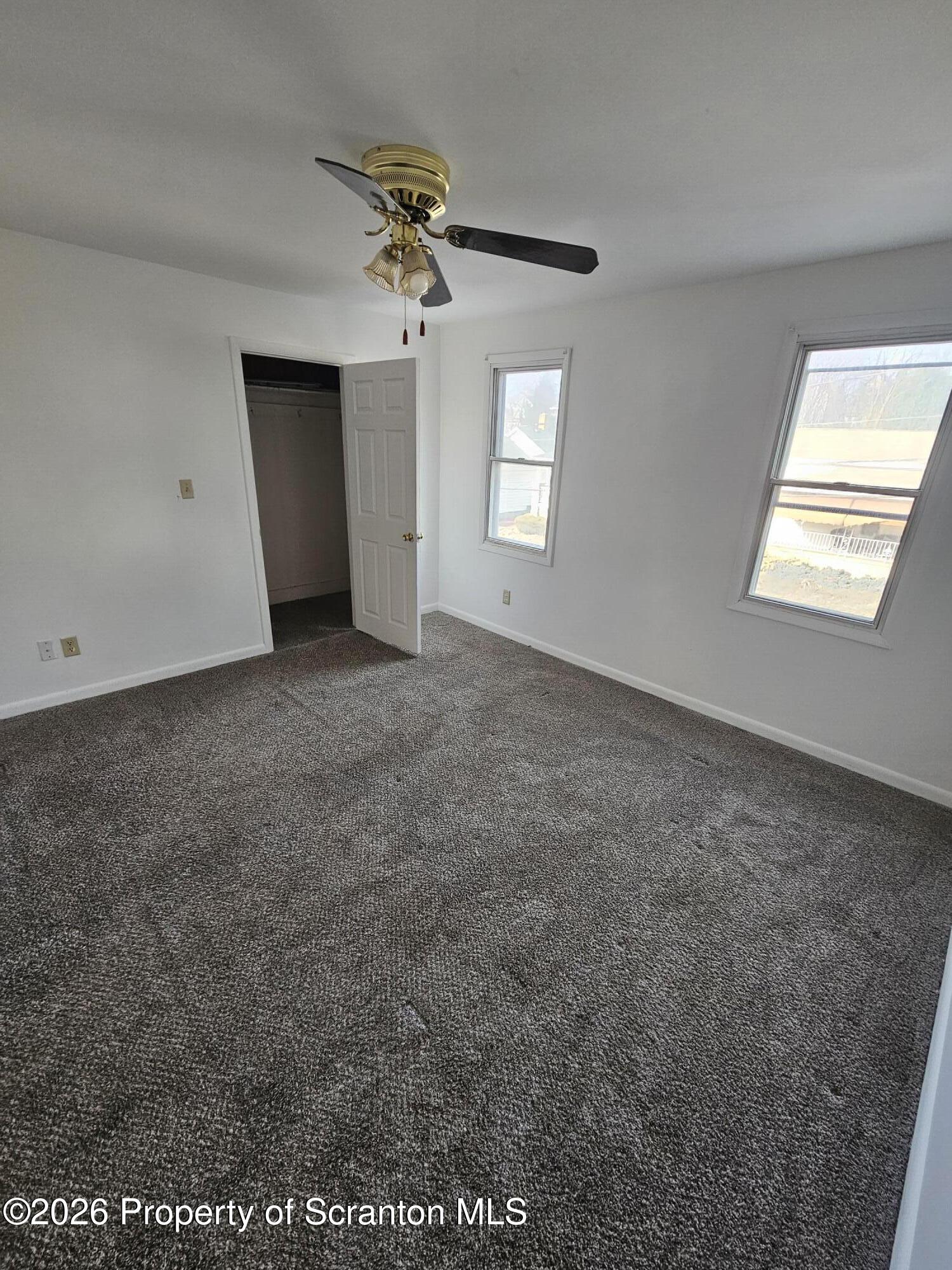 1044 John Avenue Scranton, PA 18510 - Photo 23 of 28 an empty room with windows and closet