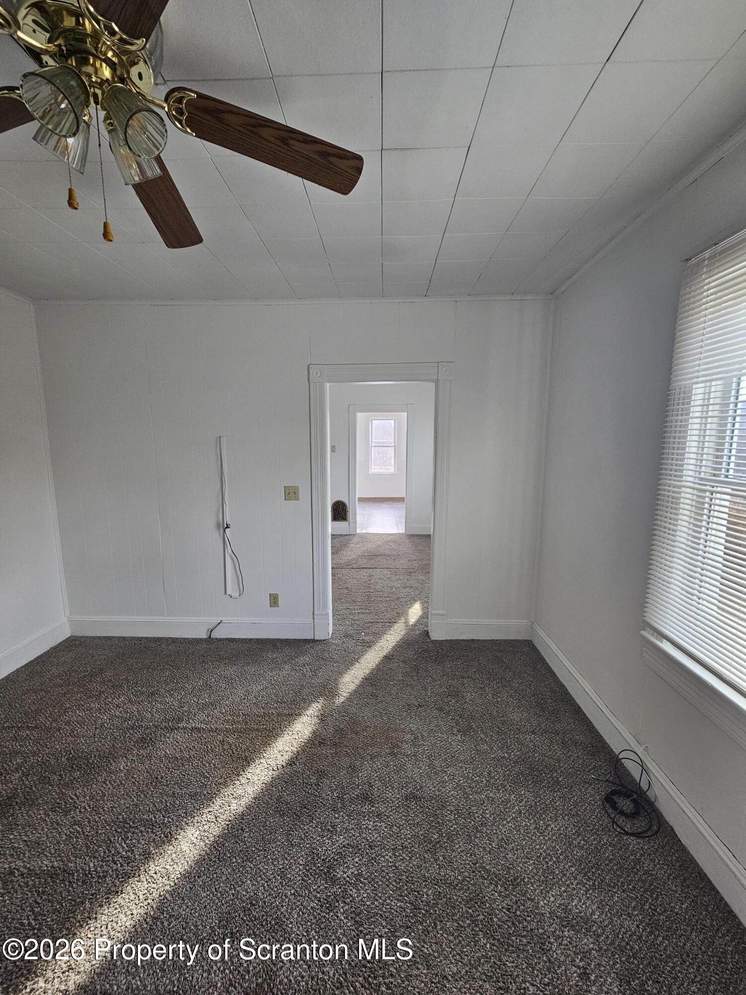1044 John Avenue Scranton, PA 18510 - Photo 9 of 28 an empty room with windows
