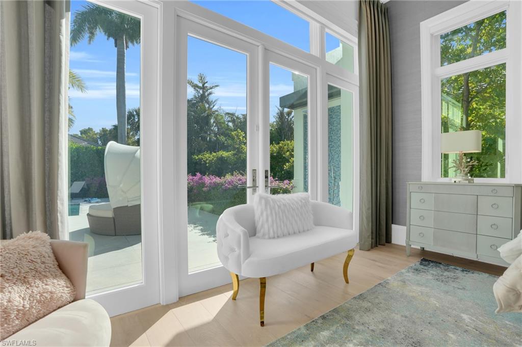 3110 Leeward Lane Naples, FL 34103 - Photo 21 of 50 a living room with furniture and a large window