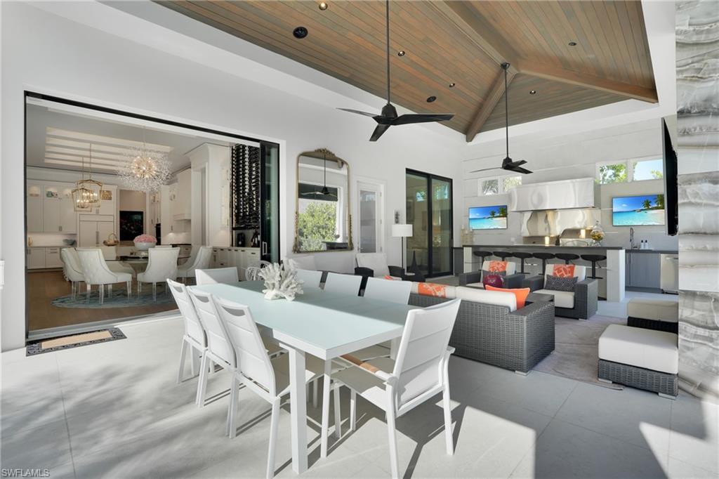 3110 Leeward Lane Naples, FL 34103 - Photo 36 of 50 a view of a dining room with furniture