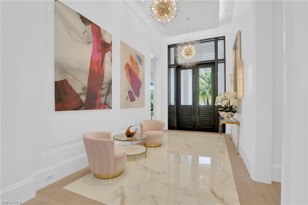3110 Leeward Lane Naples, FL 34103 - Photo 6 of 50 a living room with furniture and window