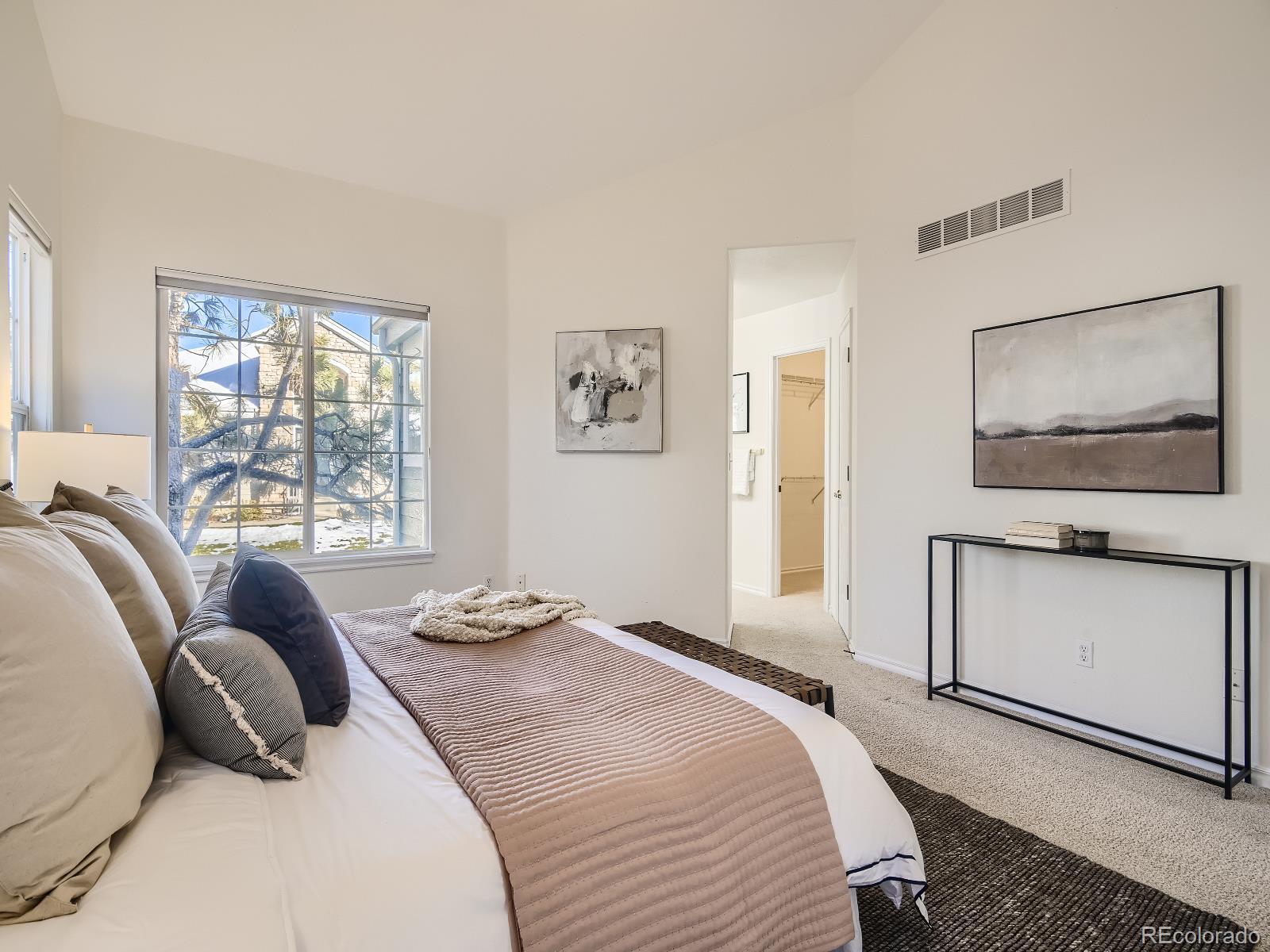 7400 West Grant Ranch Boulevard, Unit 60 Denver, CO 80123 - Photo 13 of 36 a bedroom with a bed and a window