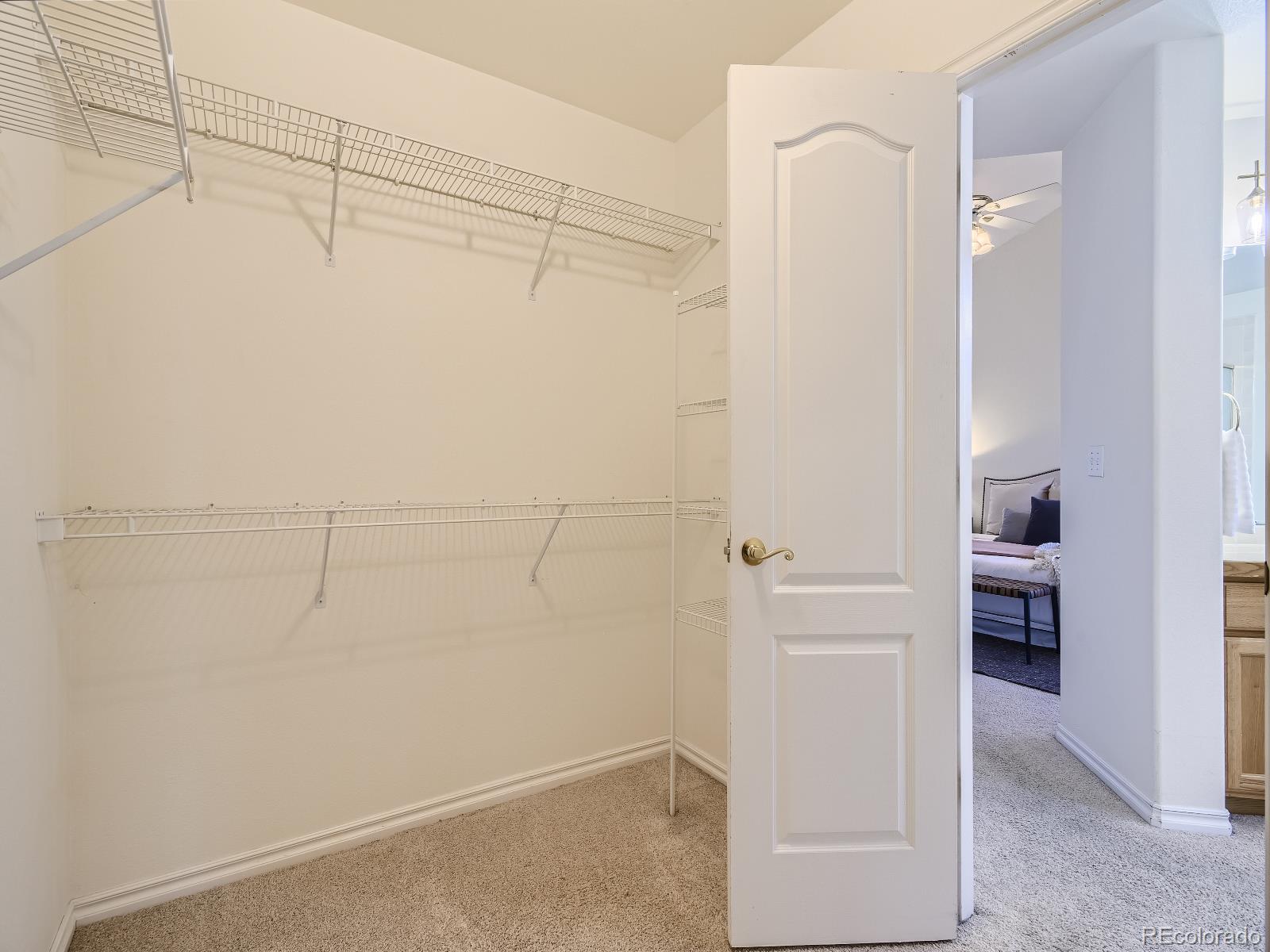7400 West Grant Ranch Boulevard, Unit 60 Denver, CO 80123 - Photo 16 of 36 a view of walk in closet with empty racks