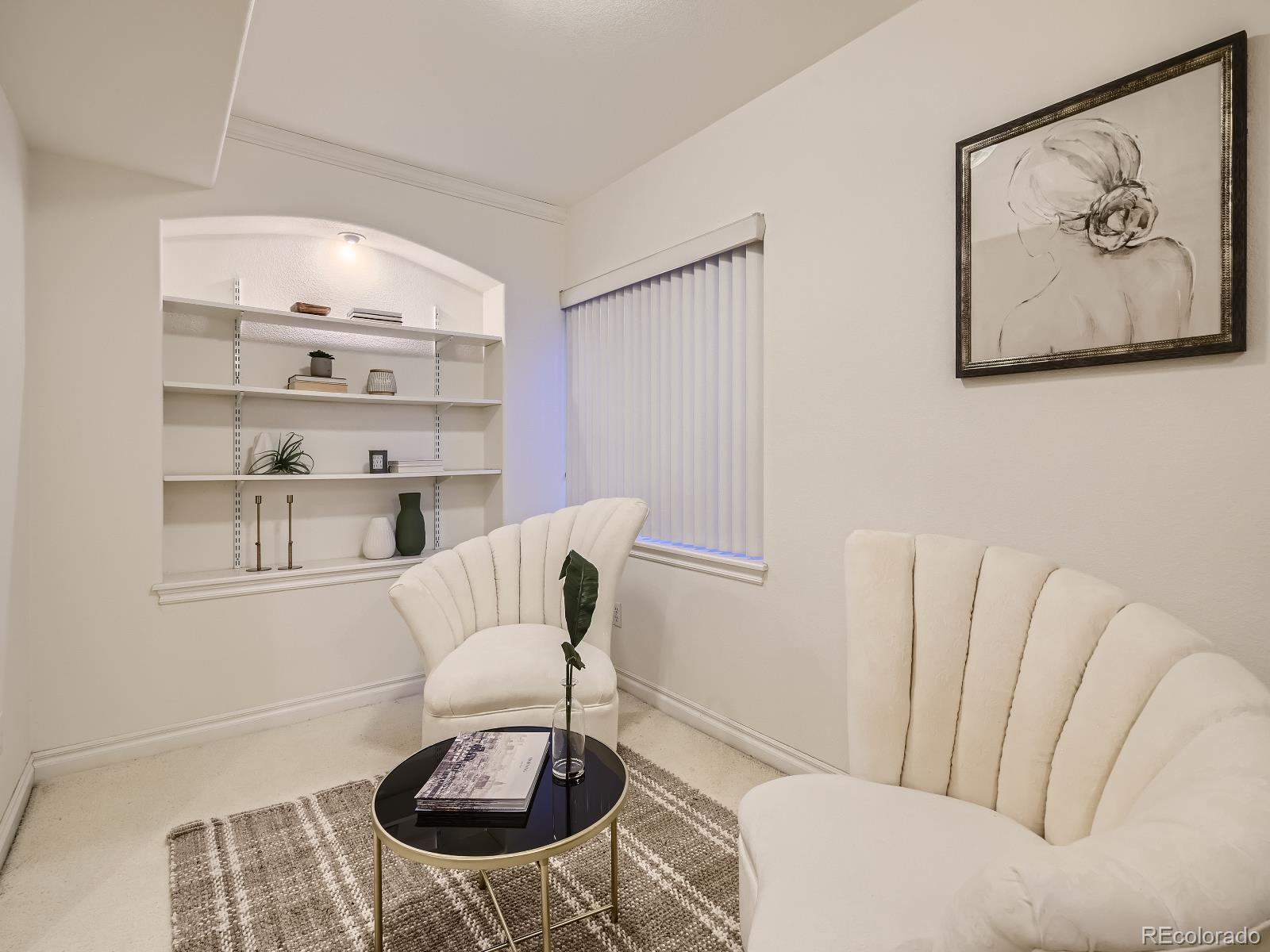 7400 West Grant Ranch Boulevard, Unit 60 Denver, CO 80123 - Photo 22 of 36 a living room with furniture and a painting